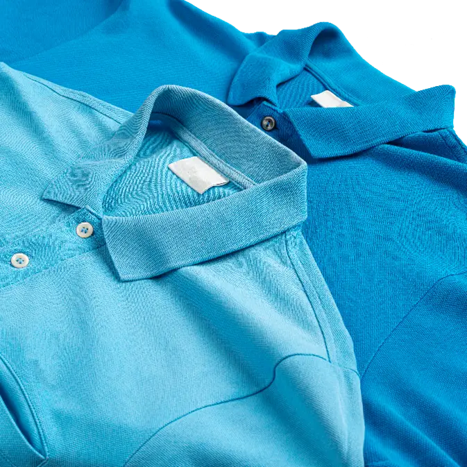 Blue corporate golf shirts laid out in an overlapping display, highlighting branded apparel options for professional and promotional use.