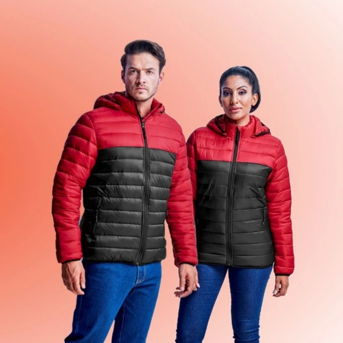 Man and woman wearing red and black branded corporate jackets, showcasing stylish and professional team apparel.